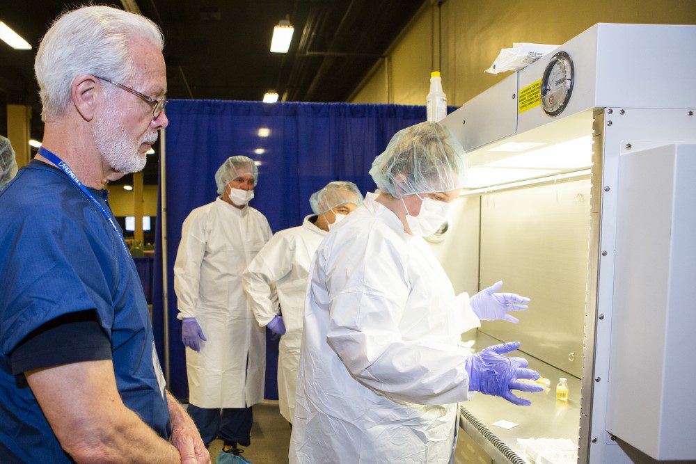 Sterile compounding practice under hoods at the NHIA conference